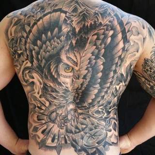 Golden anchor tattoo