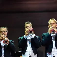 Listen to Trumpets in Concert, watch music videos, read bio, see tour dates & more!