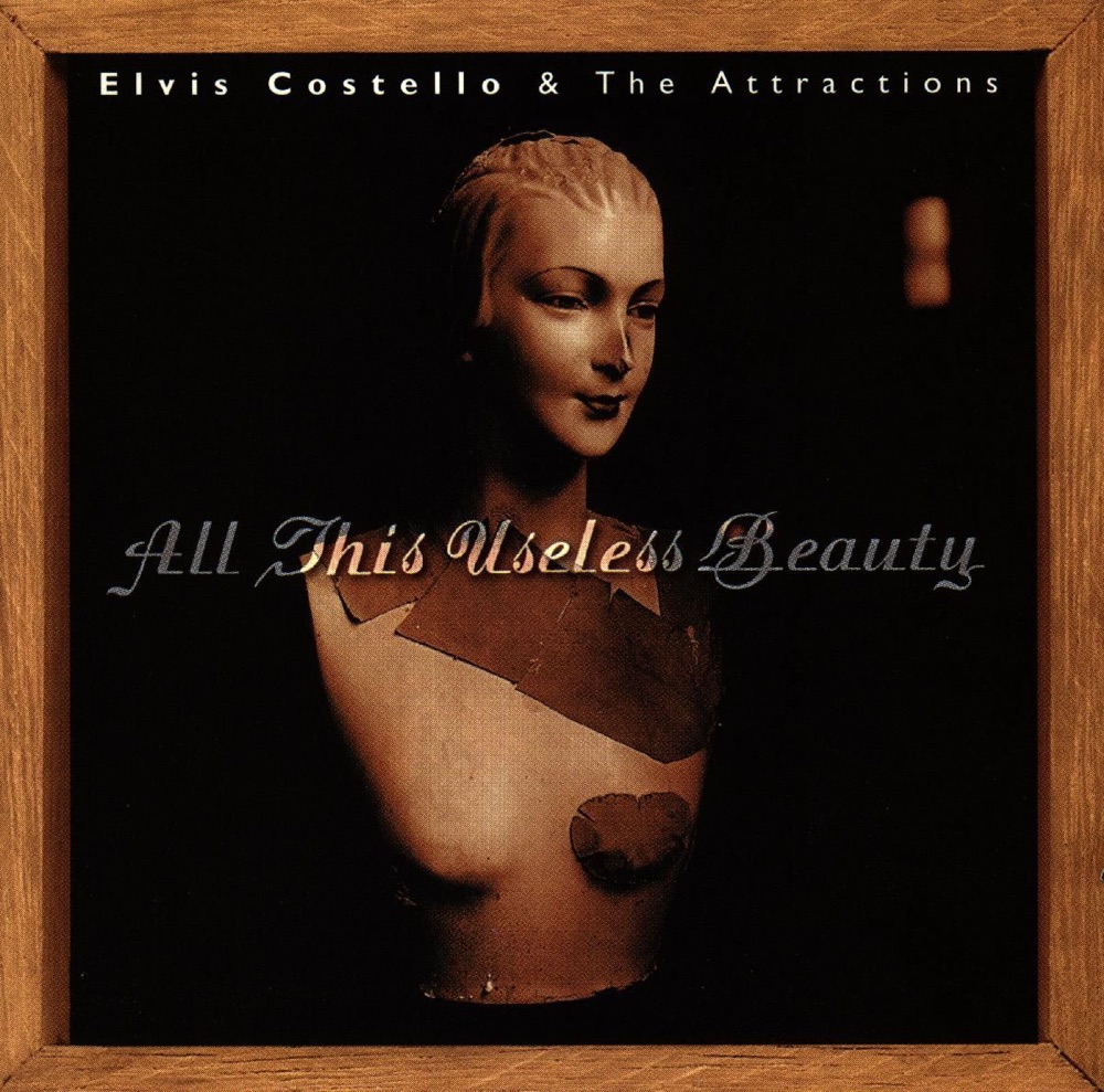 Обложка альбома «All This Useless Beauty» — Elvis Costello & The Attractions