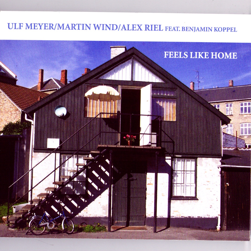 Обложка альбома «Feels Like Home» — Alex Riel, Martin Wind & Ulf Meyer