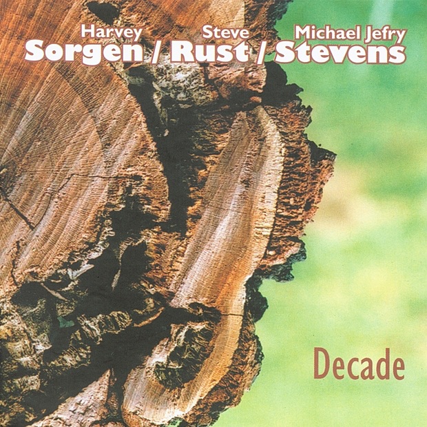 Обложка альбома «Decade» — Harvey Sorgen, Steve Rust & Michael Jefry Stevens
