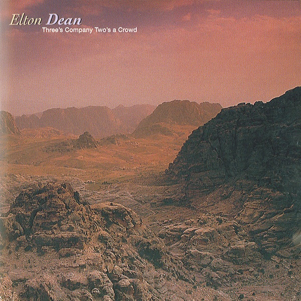 Обложка альбома «Three's Company Two's A Crowd» — Elton Dean