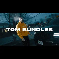 Tom Bundles: песни, клипы, биография, даты выступлений и многое другое.