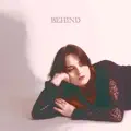 Behind