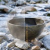 Aquamarine Aura: Tibetan Bowls with Ocean Backdrop