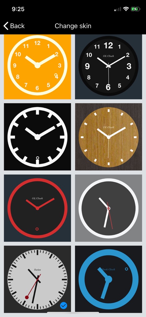 Desk Clock - Analog Clock Face - Explore diverse clock face options within the app's 'Change skin' menu, offering a range of styles from vibrant orange to elegant wood textures.