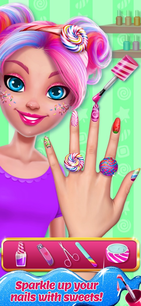 Candy Makeup Beauty Game - Esta captura destaca a criatividade na manicure, apresentando unhas decoradas com designs de doces vibrantes e anéis em formato de pirulito, complementando o visual divertido e temático.