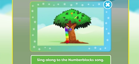 Meet the Numberblocks! - After successful counting, the app delights children with an engaging video clip featuring the Numberblocks on a tree, alongside a clear prompt to "Sing along to the Numberblocks song.".