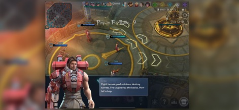 Vainglory - 플레이어는 전투 준비 화면에서 영웅 '아르단'의 대화 상자를 통해 전략적 조언을 받을 수 있으며, 바닥에는 다음 이동 경로를 나타내는 화살표 지시자가 보입니다.