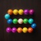Spin the puzzle and strategize your moves as balls cascade from above