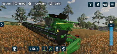 Farming Simulator 23 Mobile - L'app consente di gestire il raccolto con precisione, mettendo in mostra l'imponente mietitrebbia John Deere di colore verde brillante e il vasto campo di grano maturo.
