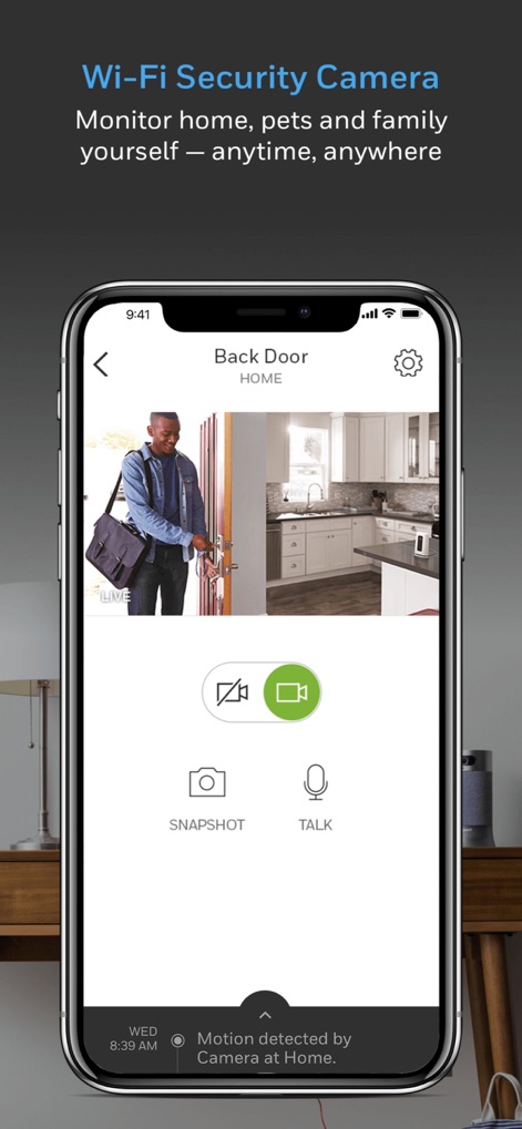 Resideo - Smart Home - Observe the "Wi-Fi Security Camera" view, offering a live feed of the "Back Door" and interactive "SNAPSHOT" and "TALK" functionalities for real-time interaction.