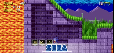 Sonic The Hedgehog Classic - This screenshot reveals the challenging platforming mechanics, featuring intricate purple brick walls and the classic ring collection element critical to progression.