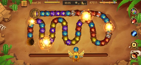 Jungle Blast - Bubble Shooter - Découvrez les explosions dynamiques des billes, propulsant le jeu au cœur d'un décor désertique thématique avec ses pyramides et ses cactus.