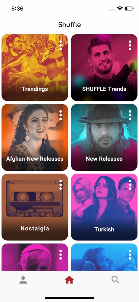 Shuffle Music - ホーム画面には、「Trendings」や「SHUFFLE Trends」といった人気のチャンネルと、「Afghan New Releases」や「Turkish」といった地域別の新譜がグリッド形式で表示され、ユーザーは様々な音楽を探索できます。