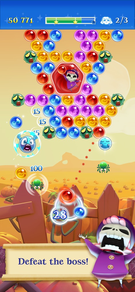 Bubble Witch 2 Saga - Engage in thrilling boss battles against formidable opponents, such as the cloaked skeleton character, while strategically clearing specialized enemy bubbles.