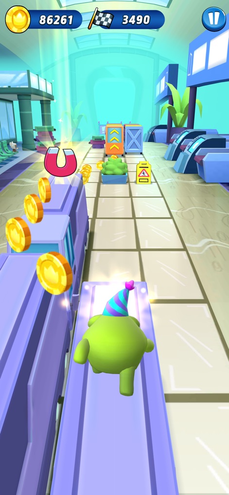Om Nom: Run - Witness the strategic use of magnet power-ups to collect coins within a detailed, industrial-themed environment.