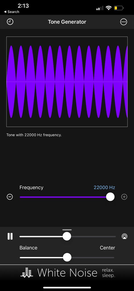 Tone Generator: Audio Sound Hz - Explore the app's capability to generate extreme frequencies, clearly depicted by the vibrant purple sine wave visualizer and the precise 22000 Hz frequency slider.