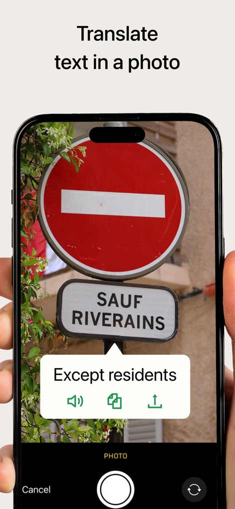 PONS Translate & Dictionary - The app enables immediate translation of text from images, like the 'SAUF RIVERAINS' sign, providing clear results and options to hear or copy the translation.