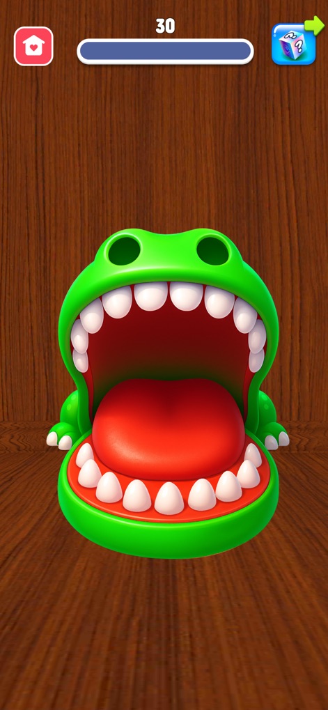 Antistress: Relaxing Mini Game - This screenshot highlights interactive gameplay with a whimsical green crocodile toy, showcasing its wide-open mouth and a visible score counter at the top.