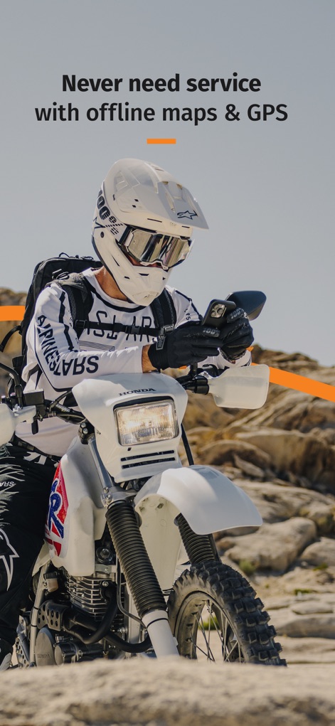 REVER - Motorcycle GPS & Rides - This app ensures uninterrupted navigation in remote areas, utilizing offline maps and built-in GPS capabilities, as exemplified by the rider checking their phone in a rugged, off-road setting.