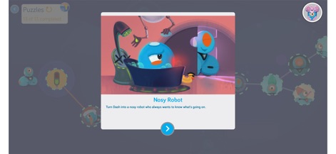 Blockly for Dash & Dot robots - Una ventana emergente introduce un desafío específico con ilustraciones temáticas, acompañando una descripción narrativa que guía a los usuarios en la tarea de programación.