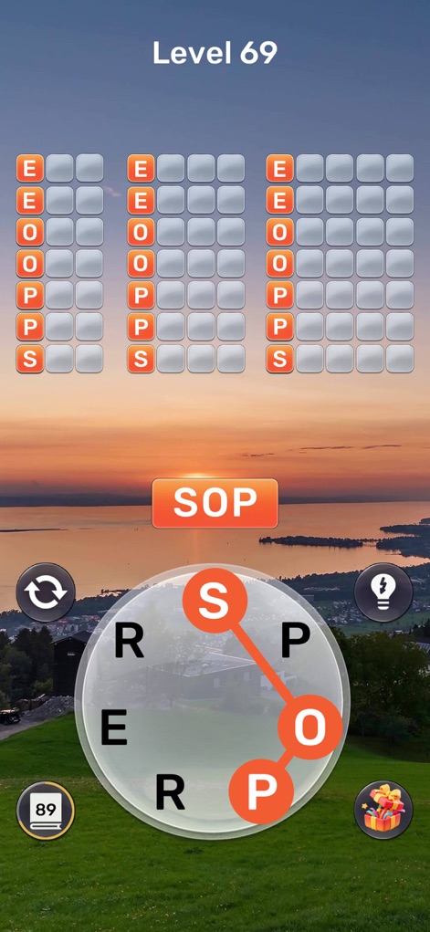Word Oasis: Calm Puzzle Game - Witness the app's stunning sunset background and the harmonious orange color scheme that brings warmth to the puzzle elements.