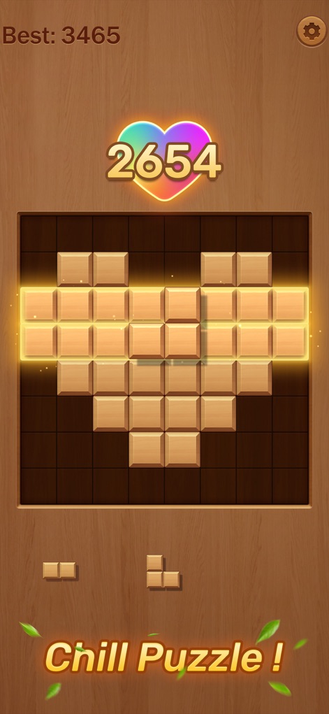 Woody Block:Puzzle Blast - En esta escena, los usuarios pueden observar una disposición artística de bloques de madera formando un corazón brillante, mientras que el mensaje "Chill Puzzle!" y la estética general subrayan la naturaleza relajante y visualmente agradable del juego.