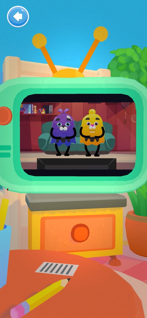 Slimy World: Talk & Play - Experience shared moments through a vintage television displaying adorable characters, complemented by nearby stationery like pencils for creative thought.