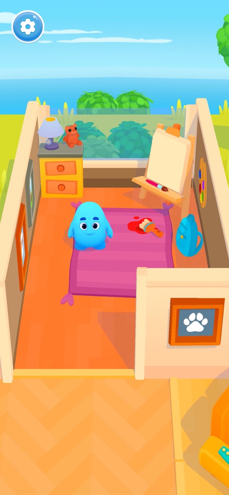 Slimy World: Talk & Play - An aerial view reveals a customizable room setting, complete with an art easel and a scenic window vista, allowing users to tailor their play space.