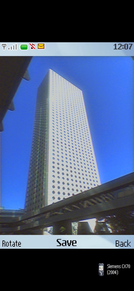0.3MP Camera - Capture striking architecture with the characteristic look of a "Siemens CX70 (2004)" camera, then use the prominent "Save" button to keep the retro image.