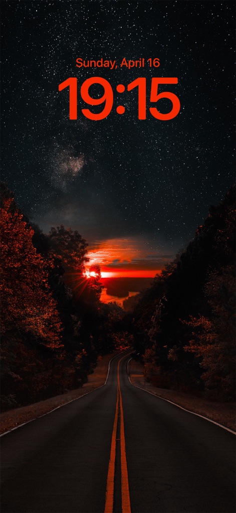 Wallcraft – Wallpapers, live - This initial view showcases a stunning lock screen wallpaper featuring a vibrant sunset over a winding road and a cosmic starry sky.