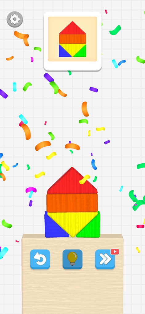 Color Block Builder - Esta tela celebra a conclusão de um desafio, exibindo a forma de 'casa' montada com blocos coloridos e a animação de confetes, indicando sucesso e satisfação.
