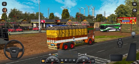 Truck Masters: India Simulator - Experience the vibrant local flavor with a decorated Indian truck parked near an authentic Punjabi Dhaba, set against a backdrop of modern windmills.