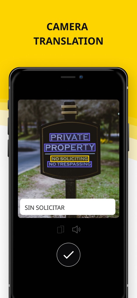 Translator Guru: Voice & Text - La función de traducción por cámara procesa el texto de señales o menús en tiempo real, con el texto original "PRIVATE PROPERTY" y su traducción "SIN SOLICITAR" claramente visibles.