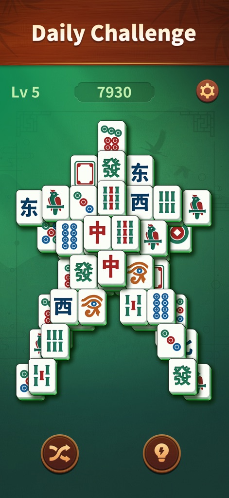 Jade Mahjong - Explore the "Daily Challenge" mode which offers fresh, unique tile patterns, accompanied by easy-to-use shuffle and hint options at the screen's base.