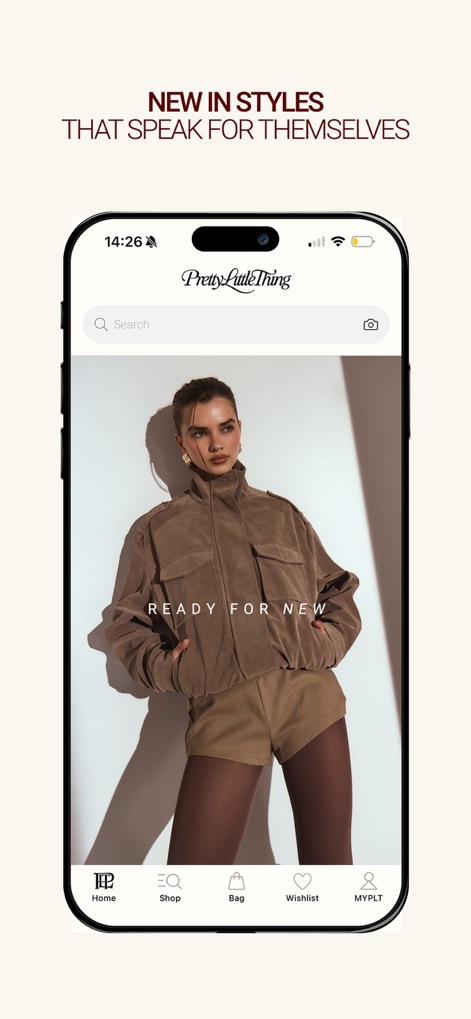PrettyLittleThing - Explore the app's dynamic homepage, featuring a captivating 'NEW IN STYLES' banner and an intuitive bottom navigation bar for seamless browsing.