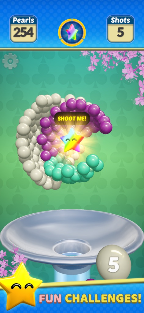 Pearl Gem! - La aplicación presenta desafíos únicos con la peculiar formación en espiral de perlas y el objetivo brillante en el centro, invitando a una estrategia de disparo precisa.