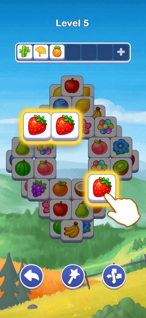 Tile Voyage: Match Puzzle - This screenshot highlights the satisfying triple-match mechanic with vibrant strawberry tiles and the calming hilly green landscape background.