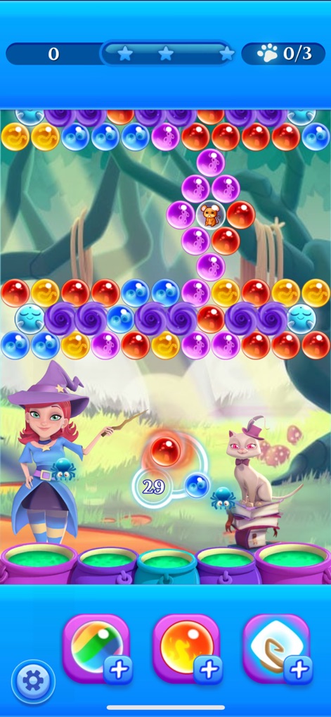 Bubble Witch 2 Saga - Navigate through enchanting forest environments, encountering diverse bubble types like the purple swirly patterns and blue wavy bubbles to complete each level.