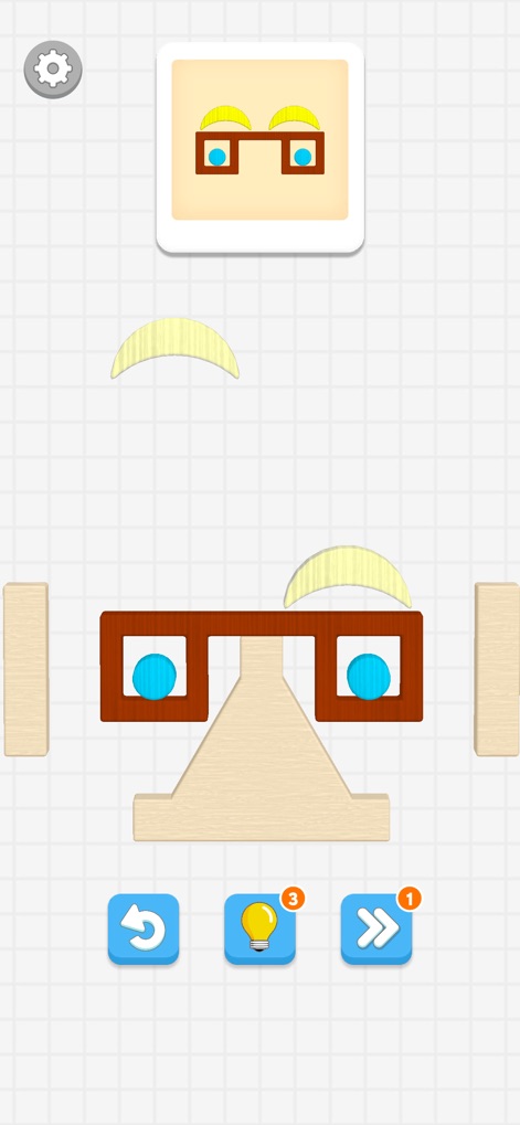 Color Block Builder - A ferramenta permite a criação de formas complexas, como o rosto com óculos, utilizando uma variedade de blocos geométricos e coloridos, que se encaixam para formar a imagem desejada.