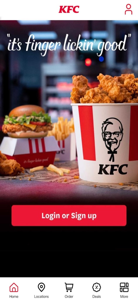 KFC Nederland - Die Startseite präsentiert eine ansprechende Mahlzeitendarstellung mit einem prominenten Eimer Hähnchen und Burger, während der 'Login or Sign up'-Button die sofortige Interaktion des Nutzers fördert.