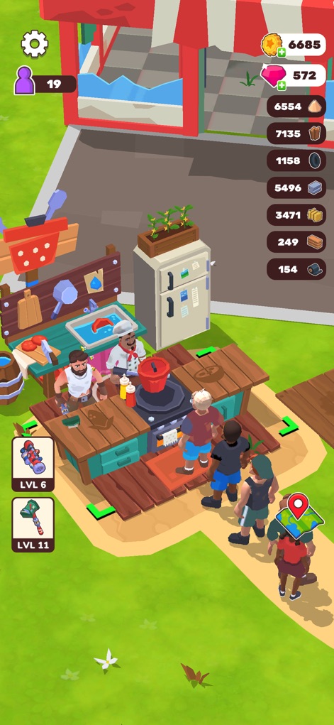 Wasteland Life: Survival Idle - La instantánea exhibe una bulliciosa zona de cocina con varios personajes colaborando, destacando el refrigerador blanco y la estación de fregadero con un pescado en ella.