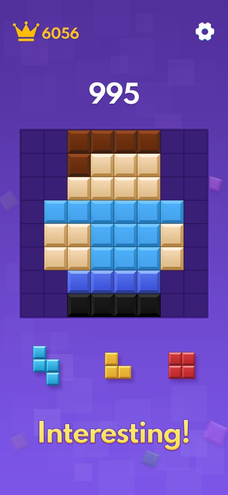 Block Blast - Top Block Puzzle - The app presents unique block art challenges, encouraging users to build detailed patterns like this character, marked with an "Interesting!" discovery.