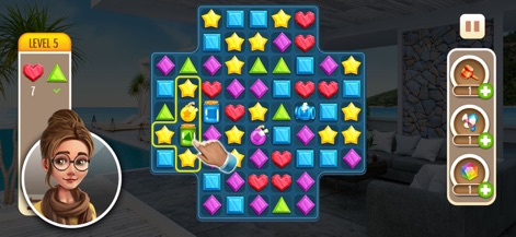 My Home Makeover: Dream Design - El juego integra la resolución de puzzles de combinaciones, donde se observa un tablero con gemas de colores y la interacción para realizar un emparejamiento.