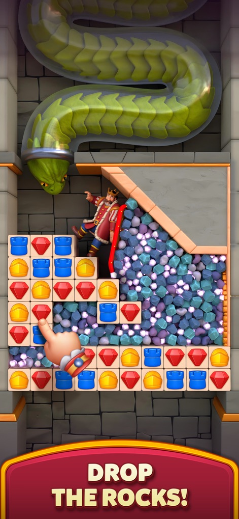 Royal Kingdom - この画面では、巨大なヘビの頭の下で王様が岩石の危険に晒されており、プレイヤーは落下する岩石を避けて王様を安全に導くためのパズルを解きます。上部に見えるヘビの顔と、王様を覆い尽くす可能性のある岩石の山が、危機的な状況を強調しています。