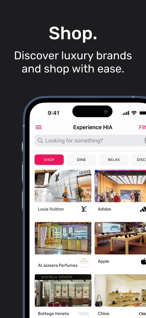 HIA Qatar - This section allows users to effortlessly browse an extensive array of luxury brands, from 'Louis Vuitton' to 'Apple', facilitating a premier shopping experience.
