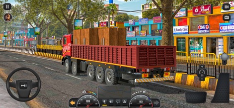 Truck Masters: India Simulator - Drive a robust red flatbed truck through a bustling urban street, passing by colorful storefronts and everyday city life.