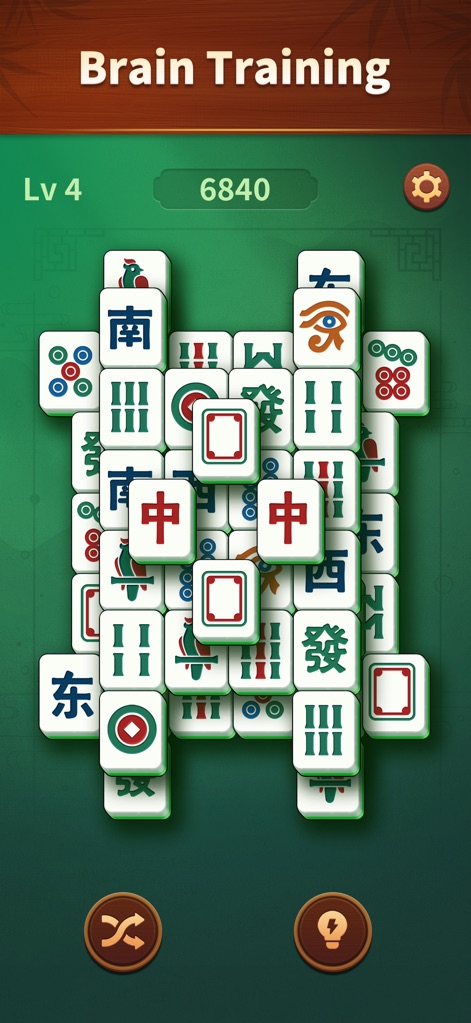 Jade Mahjong - Discover the "Brain Training" aspect highlighted by the banner, presenting an intricate tile arrangement designed to stimulate strategic thinking and memory.