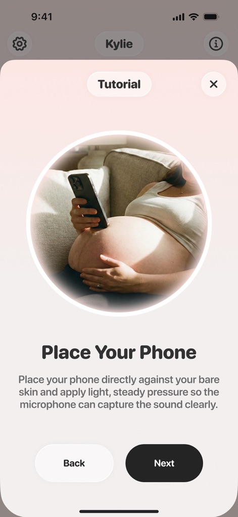 Baby Heartbeat Monitor - Molio - This tutorial segment highlights the instructional phone placement visual on the abdomen and emphasizes the need for direct skin contact.